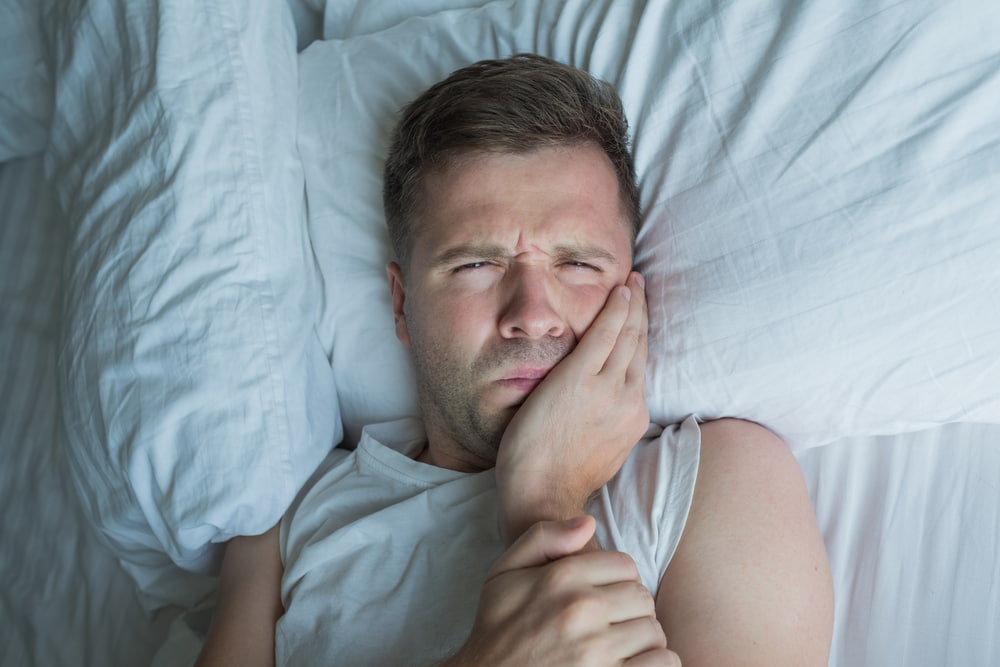 What Side to Sleep on with a Toothache: Tips for Better Sleep